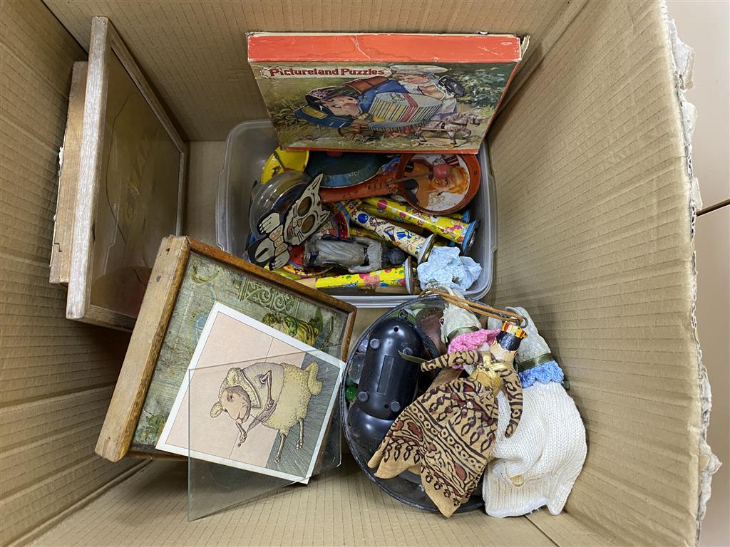 A group of childrens games and toys and a Victorian mechanical kaleidoscope effect lantern slide